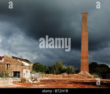 Old industrial chimney stack, prepped for demolition. Stock Photo