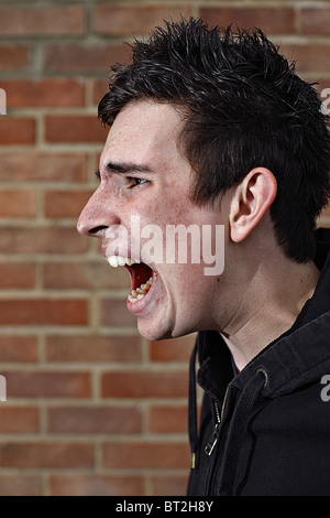 Teenage boy shouting. Stock Photo