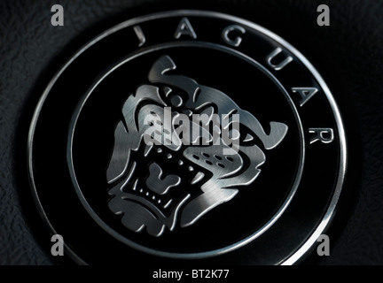 Macro photo of the famous Jaguar badge on the steering wheel of a Jaguar car. Editorial use only. Stock Photo