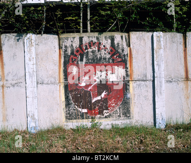Graffiti on a concrete wall depicting safety regulation (electric shock) in a former Russian barrack Leipzig, Saxony, German Stock Photo