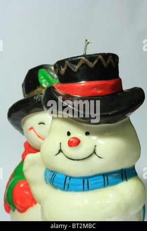 Christmas decorations- wax snowman candles in studio light Stock Photo