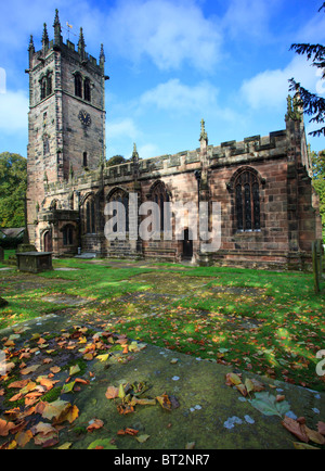 St James Church at Gawsworth taken from the graveyard with autumn leaves on the ground Stock Photo