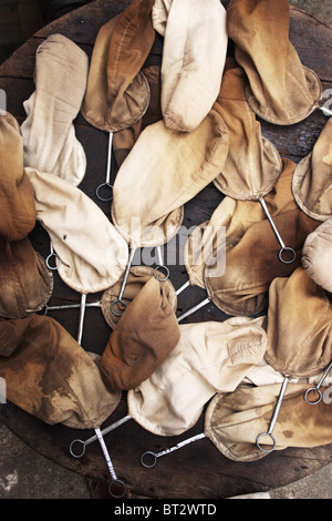 A collection of cloth coffee filters are set out to dry in front of a sidewalk coffee shop in Phnom Phen, Cambodia. Stock Photo