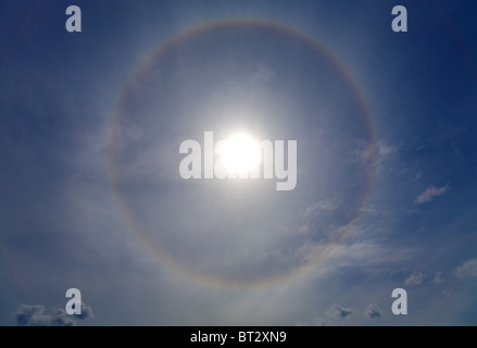 Circles halo in the blue sky around of the sun Stock Photo