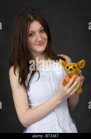 Teenager - girl hold a toy - the doggie Stock Photo