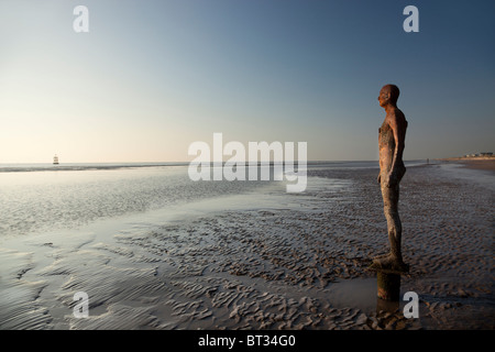 The Sir Antony Gormley art installation Another Place  located on Crosby Beach, part of the Sefton Coast, within the Liverpool City Region of the UK Stock Photo