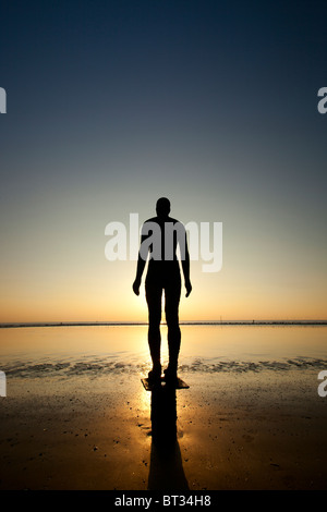 The Sir Antony Gormley art installation Another Place  located on Crosby Beach, part of the Sefton Coast, within the Liverpool City Region of the UK Stock Photo