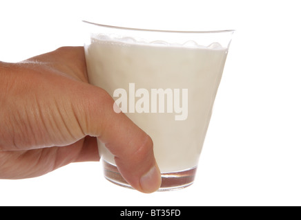 Hand holding glass of milk studio cutout Stock Photo