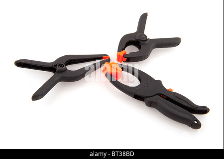 glue clamps in black and orange on white background Stock Photo