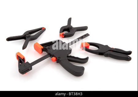 glue clamps in black and orange on white background Stock Photo