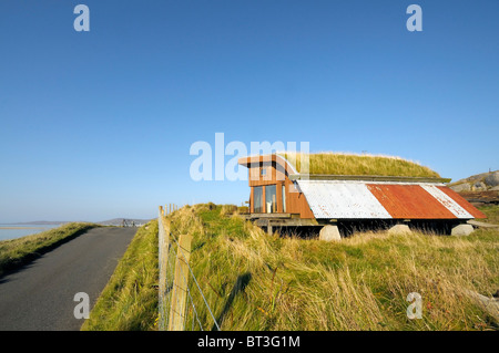 Eco/alternative house built from new and reclaimed materials with a turf roof Stock Photo