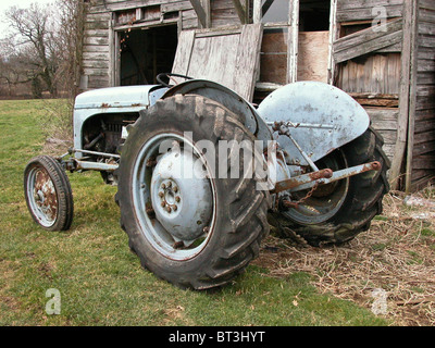 This is an unrestored version of the little grey fergy  fergie tractor the Ferguson TEA  built in 1950 waiting to be rescued Stock Photo