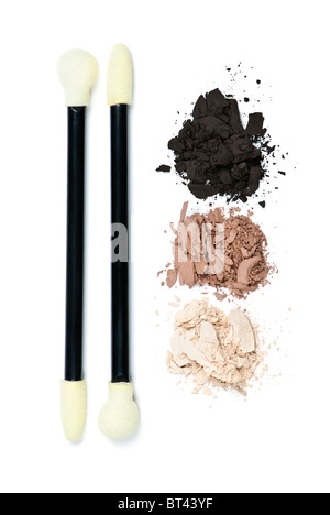 Eye shadow makeup applicators with crushed loose powder cosmetics Stock Photo