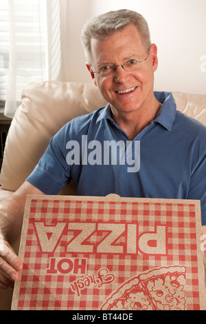 Mature Man with Pizza Delivery Stock Photo