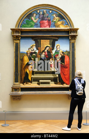 Madonna and Child Enthroned with Saints, ca. 1504, altarpiece by Raphael Stock Photo