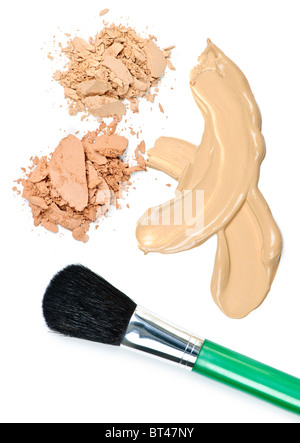 Cosmetic foundation cream and powder with brush on white background Stock Photo