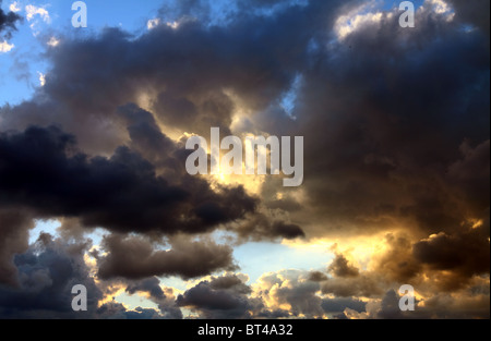 Ray of light in the sky covered with clouds Stock Photo