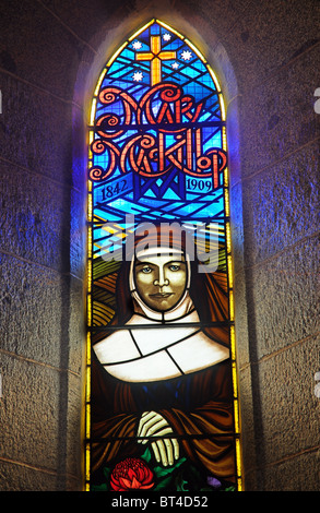 A stained glass window showing Mary McKillop, the australian canonised by Pope Penedict XVI Stock Photo