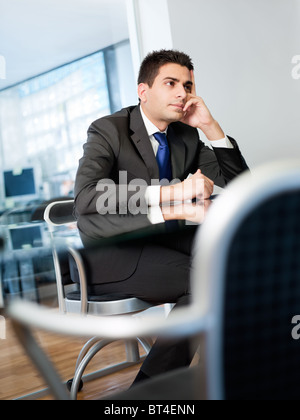 bored businessman in meeting room Stock Photo