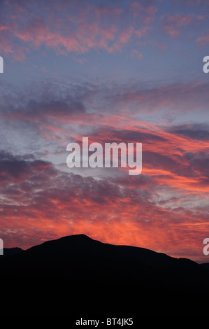 Dramatic sunset sky over Coniston Old Man, mountain in the English Lake District Stock Photo