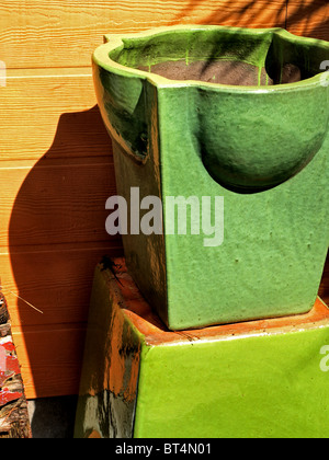 ceramic pottery pots used in gardens patios planters Mexican style clay green Stock Photo