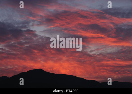 Dramatic sunset sky over Coniston Old Man, mountain in the English Lake District Stock Photo