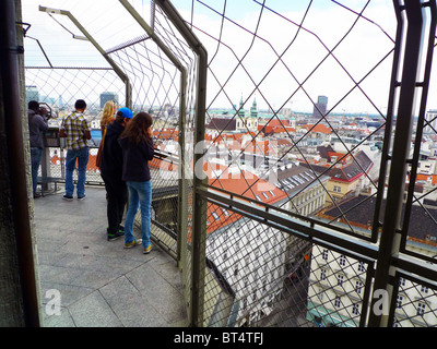 Tourists view Vienna from top of bell tower of St. Stephensdom Stock Photo