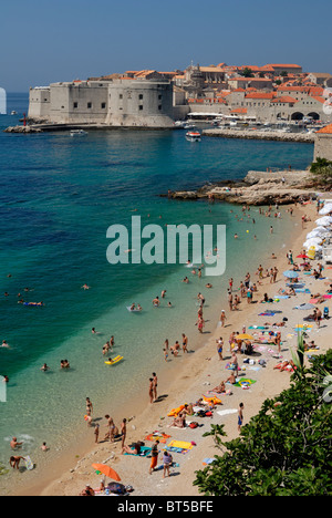 A fine view over the Banje Beach to the old harbour of Dubrovnik. The Banje Beach is the main old town beach, near Lazareti... Stock Photo