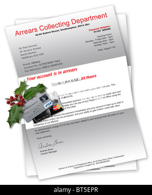 Collection agency letter with credit cards and Christmas holly on top Stock Photo