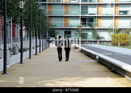 Trendy young residents in Highbury Stadium Square, home of the old Arsenal Stadium, London England UK Stock Photo