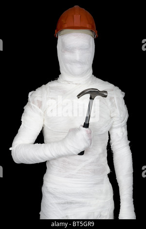 Laborer in bandages with helmet and hammer on black Stock Photo