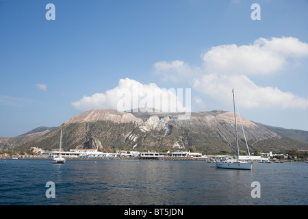 Boats anchor off Porto di Ponente on the Vulcano Island of Aeolian Islands. Stock Photo