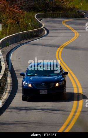 Car on a winding road upstate New York Stock Photo