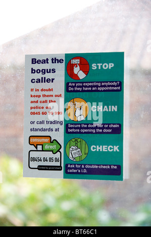 information leaflet sticker on front door window with advice to protect home owners against bogus callers Stock Photo