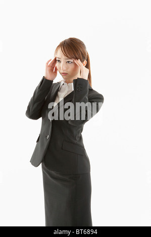 Businesswoman suffering from headache Stock Photo