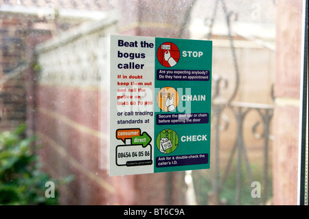 information leaflet sticker on front door window with advice to protect home owners against bogus callers Stock Photo