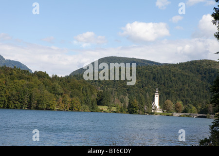 Church tower on the banks of Lake Bohinj, Triglav National Park, Slovenia Stock Photo