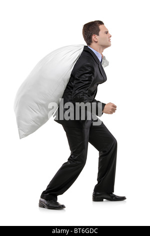 Full length portrait of a businessman carrying a money bag Stock Photo