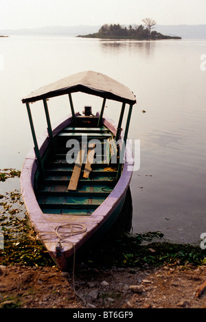 Wooden boats on the shore of Lago del Peten Itza near the Mayan ruins of Tikal- Flores, Guatemala. Stock Photo