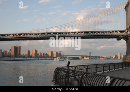 The Manhattan Bridge, East River and lower Manhattan looking north towards the Williamsburg Bridge in New York City. Stock Photo