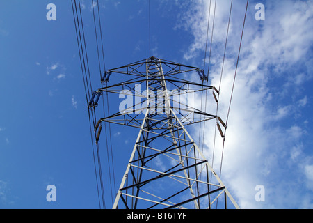 electric mast pole tower pilot on blue cloud sky cables Stock Photo