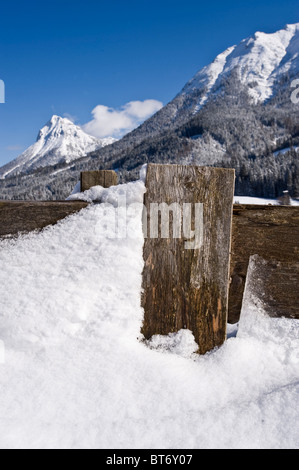 Snow-covered fence in front of Mt Guffert, alps, Tyrol, Austria Stock Photo