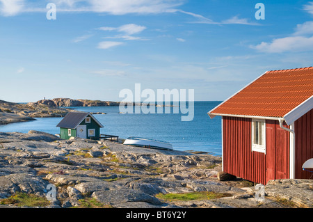 Green and red wooden houses on the sea, Smoegen, Bohuslaaen, Sweden Stock Photo