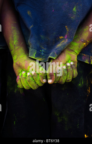 Indian boys green coloured powdered hands Stock Photo