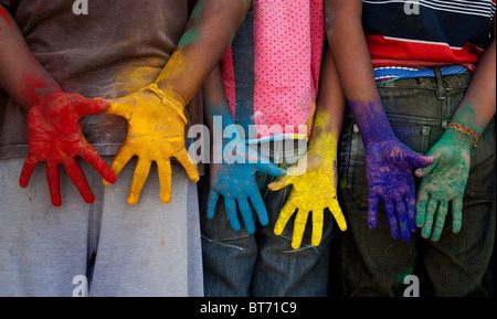 Indian boys multicoloured hands Stock Photo
