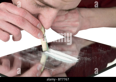 Guy smelling drug on the white background Stock Photo