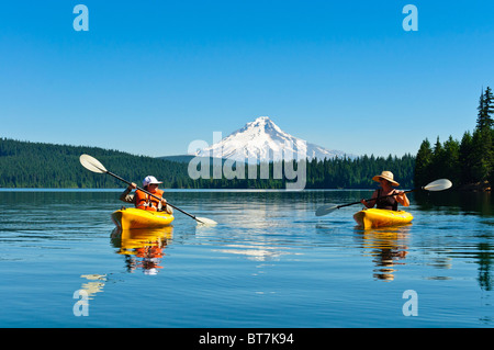 Woman and son kayaking at Timothy Lake, Mount Hood National Forest, Oregon. Stock Photo