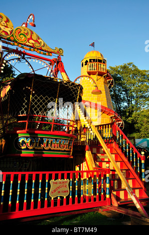 'Lighthouse Slip' and 'Steam Yachts' rides, Carter's Steam Fair, Englefield Green, Surrey, England, United Kingdom Stock Photo