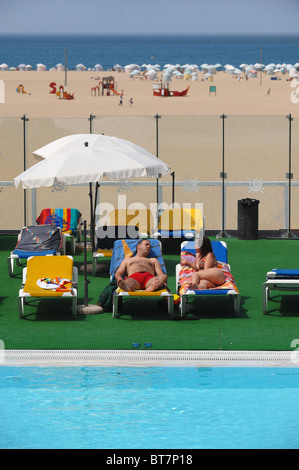 Couple sunbathing Stock Photo