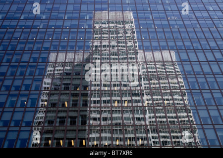 One building reflected in another, Montreal, Quebec, Canada Stock Photo